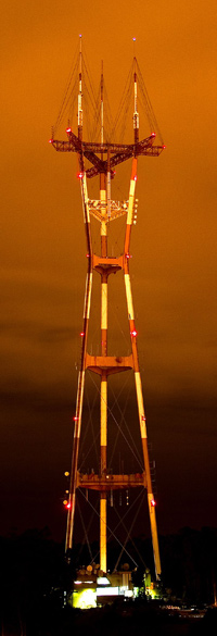 Sutro Tower at night under an orange illuminated sky