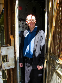 David July inside the Sutro Tower elevator located in the western leg